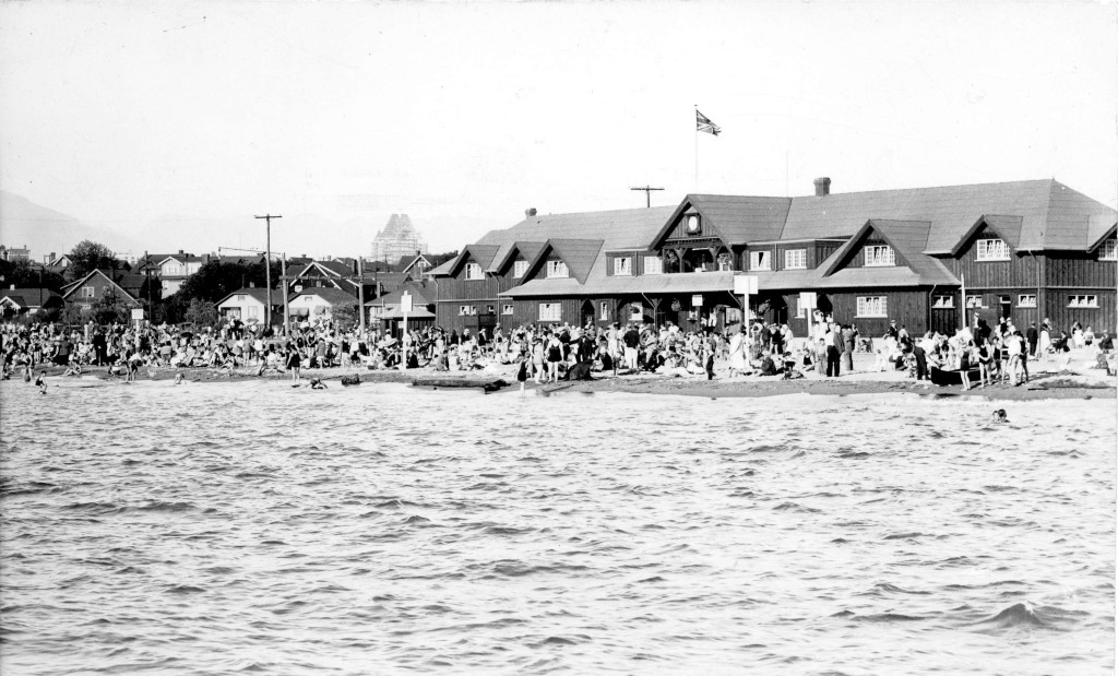 View of Kitsilano Beach, original bathhouse, gazebo and surrounding houses . 1915 Vancouver Park Board